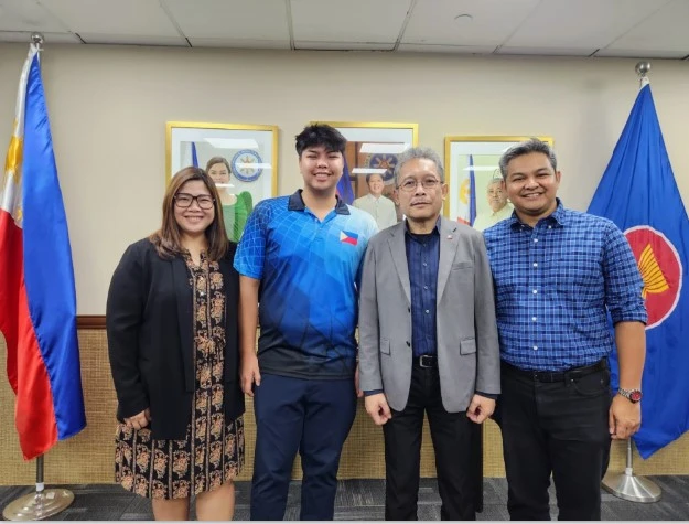 Courtesy call at the Philippine Embassy in Singapore. Grace Sales Ramin (mother), Zach Sales Ramin, Ambassador Medardo Macaraig (Philippine Ambassador to Singapore), and Rudi Ramin (father). Photo from Rudi Ramin.