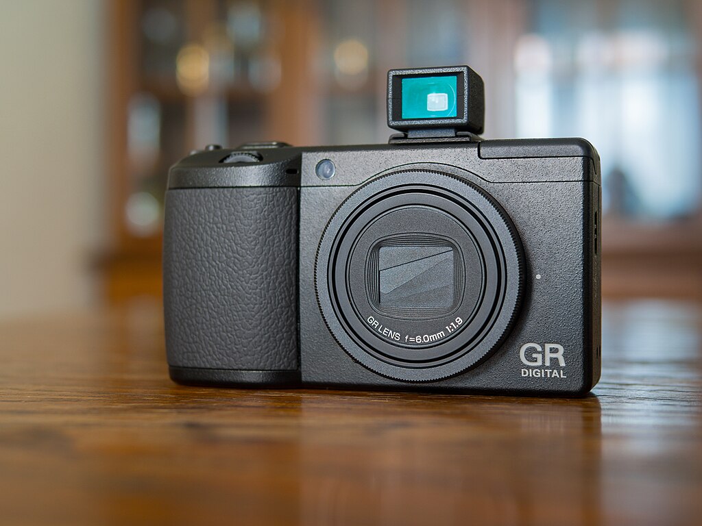 The Best Cameras for Travel Blogging & Vlogging in 2024 16 1024px Ricoh GR Digital 3 GV 2 optional viewfinder. Front view