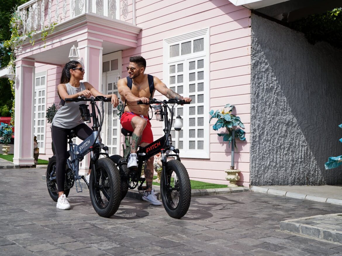man woman riding e-bike