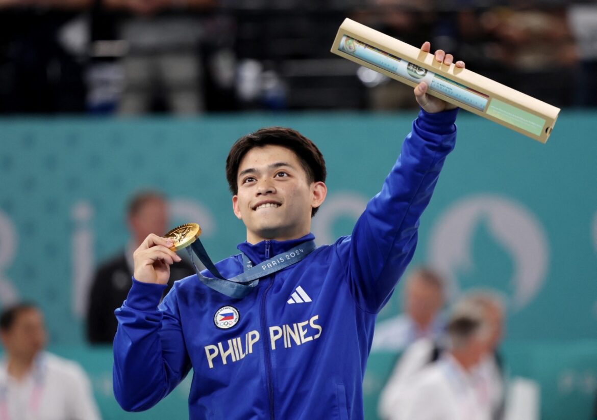 Gymnast Carlos Edriel Yulo of Philippines celebrates after his men's floor exercise performance in the 2024 Paris Olympics. Hannah Mckay / Reuters